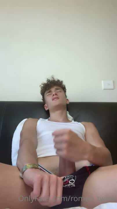 Romeo Twink strips with a hard 8 inch cock and cums on himself